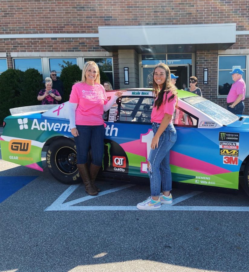 Junior Ella Boxx celebrates her mom, Nicole Boxx, after being chosen to be the spokeswoman at the AdvantHealth NASCAR event at the Shawnee Mission Medical Center on Oct. 18.

