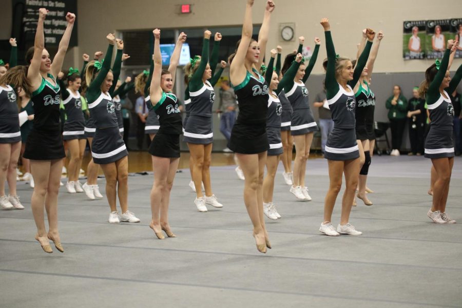 The dance team and cheerleading squad perform their routine for the Homecoming pep assembly on Oct. 18. 