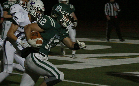 Senior running back Jake Rosen rushes towards the end zone during the Wildcats 28-14 victory over Pittsburg State on Oct. 25. DHS, now 10-0 on the season after defeating Shawnee Heights on Nov. 8 to secure the Regional championship, will face district rival Mill Valley for a chance to reach the State semifinals. 