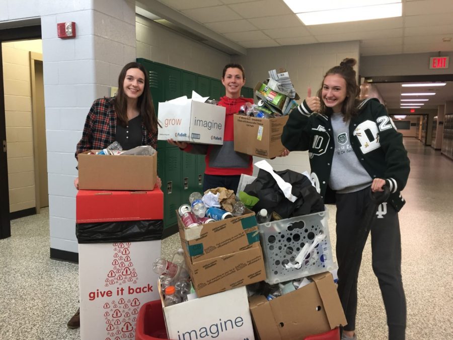 Senior Austin Bradley collects recyclable material for the Environmental Club with seniors Erin Pickert and Lauren Stanton.
