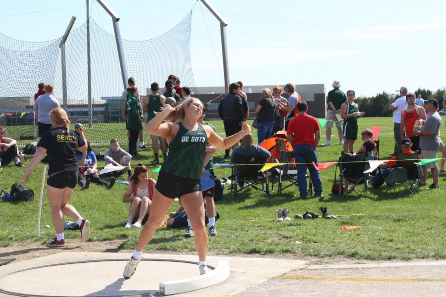 Senior Emily Fuhr throws shot put at a home track meet in the spring of 2019.