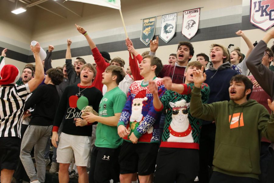 The DHS student section cheers as the boys' team wins against Bonner Springs on Dec 20.