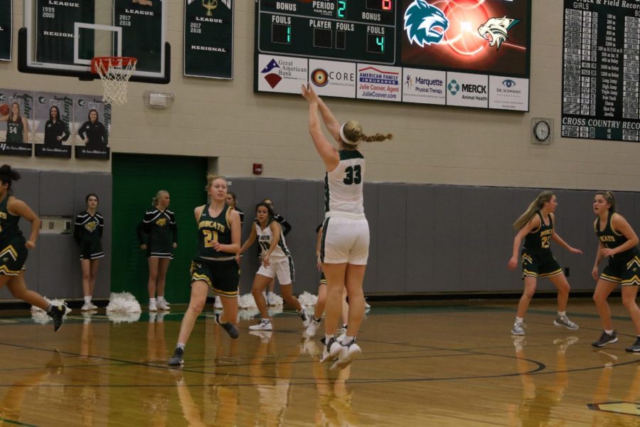 Varsity girls' basketball playing against Basehor-Linwood