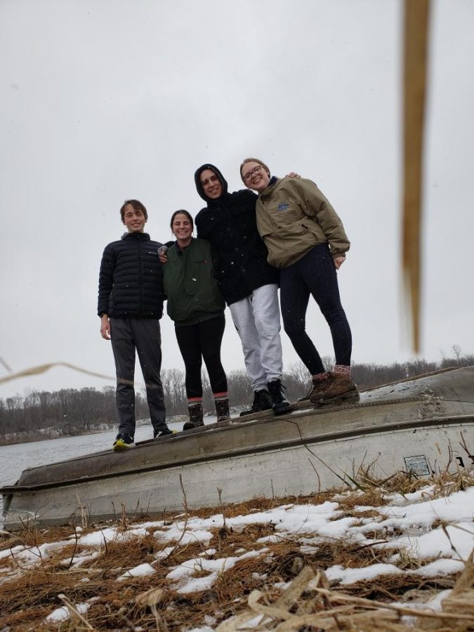 De Soto High School seniors Jack Loomis, Morgan Laney, Matthew Lingner, and Lauren Mallicoat pose for a photo by the lake behind the cabin in Iowa. Picture by Lauren Mallicoat