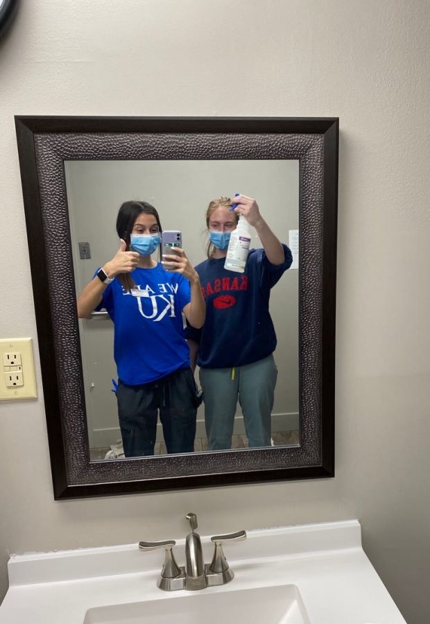 Seniors Sydney Ames and Sierra Grube pose for a picture during their shift at Hillside Village on April 26.