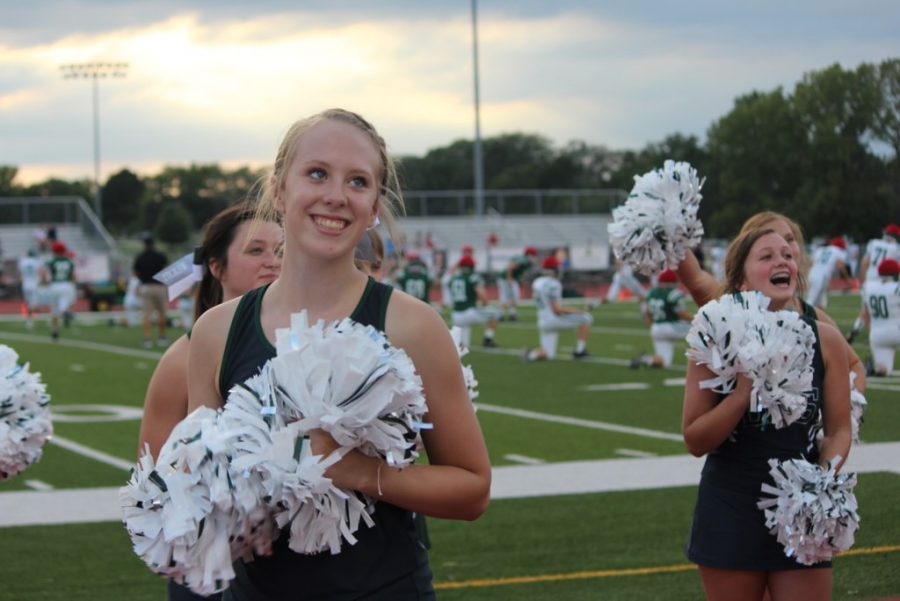 Senior Mya Conley works with her cheer teammates during Fall Fest at the De Soto High School  football field on August 23, 2019.