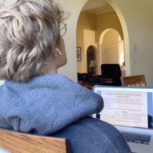 Junior Egan Putman watches a virtual math lesson on his laptop from home on April 21. 