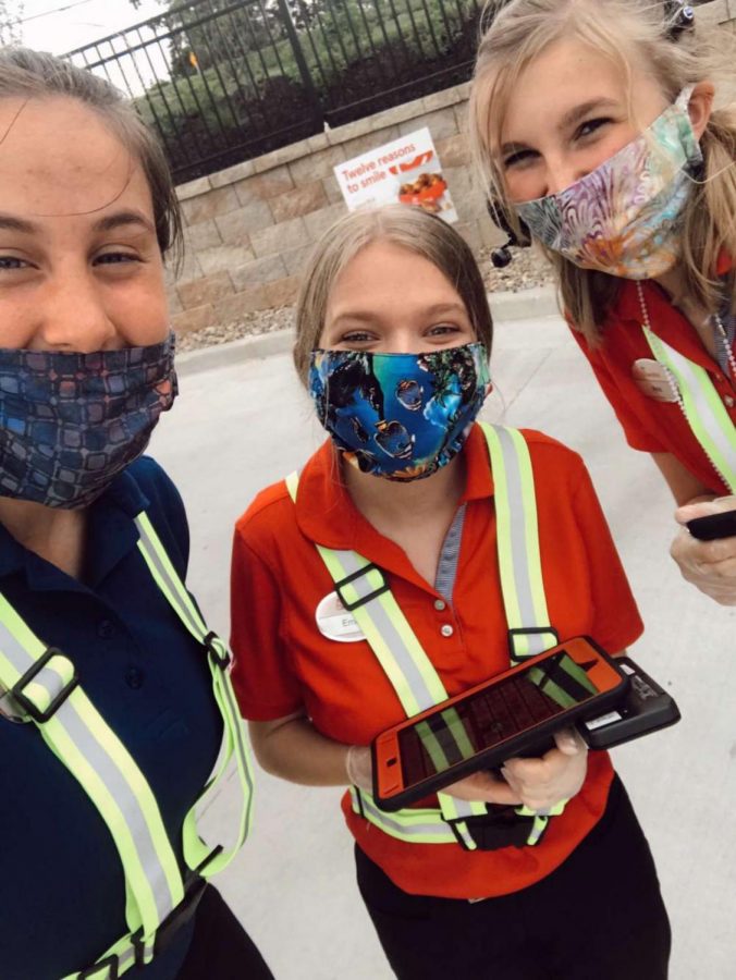 Emma Klinger poses with her coworkers at Chick-fil-A in Lenexa. Wildcat Photo. 
