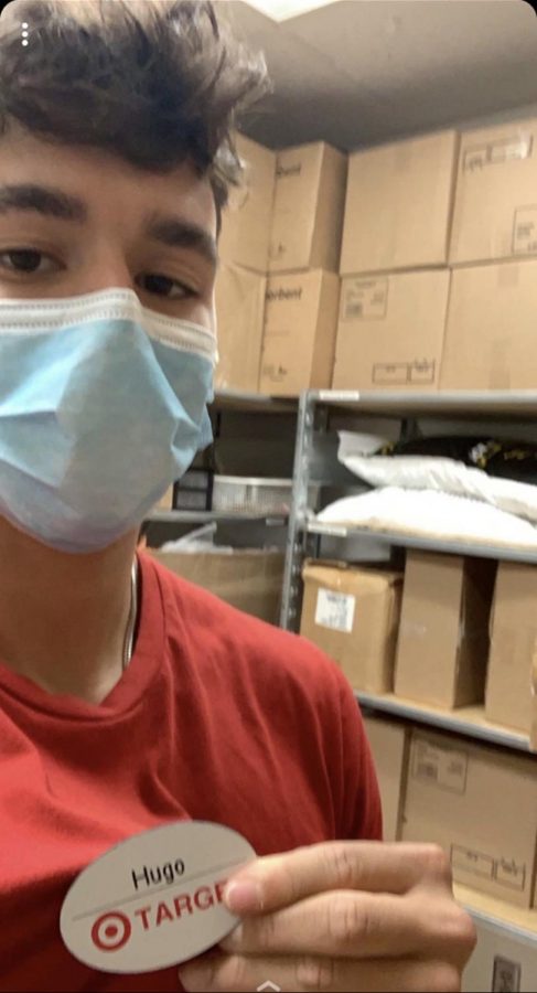 Senior Hugo Nascimento working at Target with the required mask on May 19