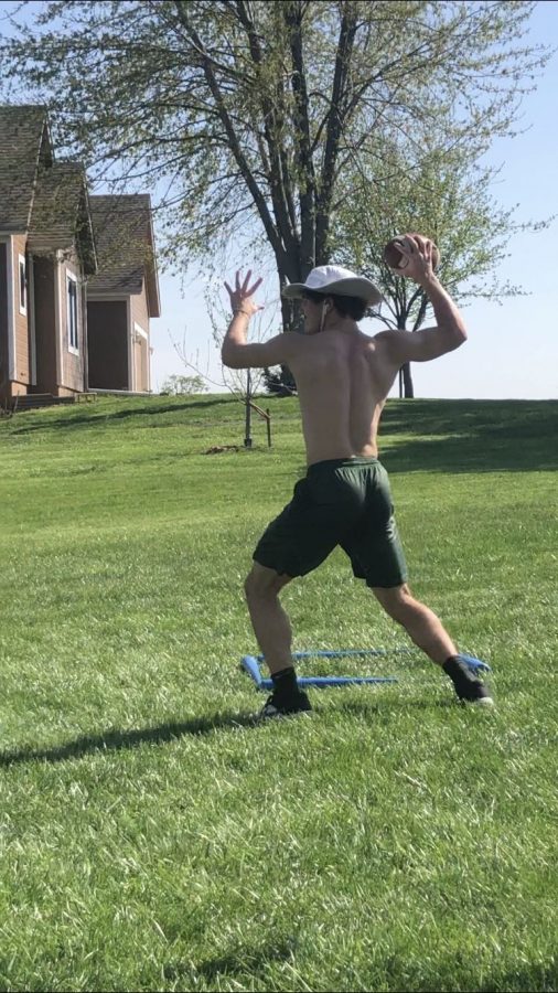 Jackson Miller throwing a football