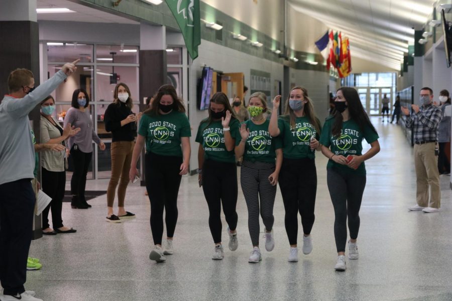 The five State qualifiers from the girls' tennis team walk the halls for their State send off on Oct. 15.