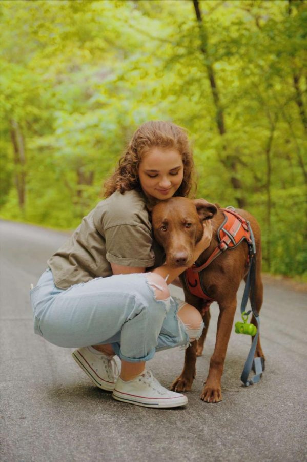 Junior Shelby Marquis goes on a walk with her dog on May 14
