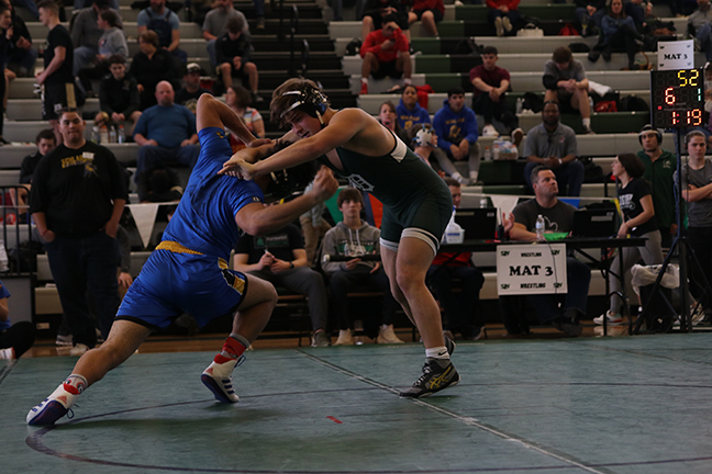 Junior Owen Nehl attempts a take down his opponent during last year's Regional tournament on Feb. 21.