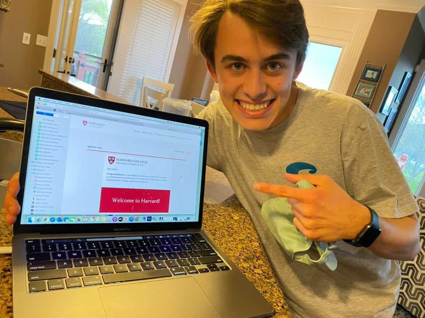 Brent Smith poses with his acceptance letter from Harvard