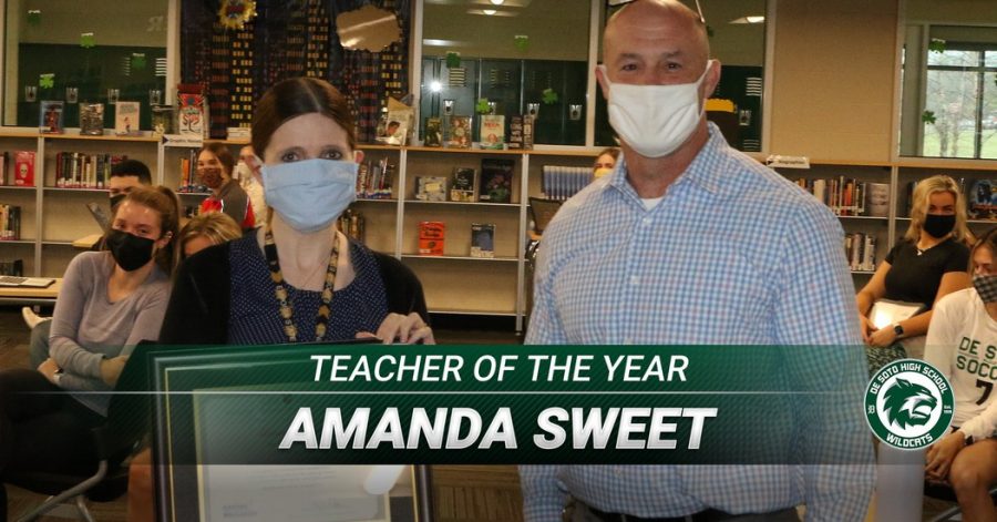 Kansas Teacher of the Year nominee Amanda Sweet poses with principal Sam Ruff after being presented with a plaque. 