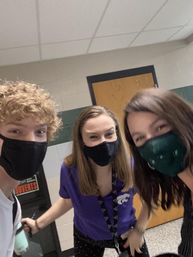 Senior Egan Putman smiles for a hallway selfie with Spanish teachers Jessica Pennybacker and Lindsay O’Neil. Putman, who has been O’Neil’s Spanish student for two consecutive years, will be graduating this year with the rest of the class of 2021.