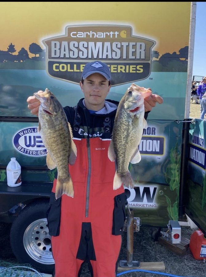 Logan Baechle holding up his two catches at the Wilson Lake bass tournament on March, 3. Earning him 3rd place.