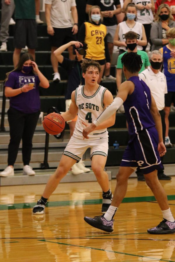 Tyler Shultze dribbles down the court during a game against Pittsburgh High School.