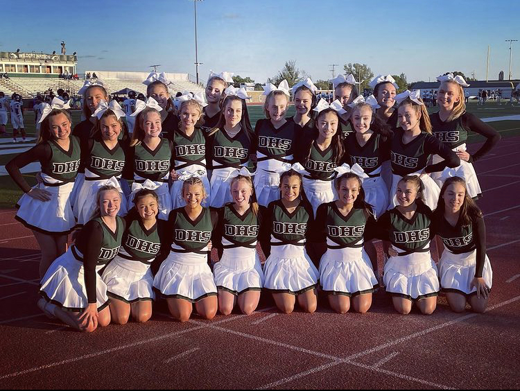 DHS cheer team poses for a picture at the football game with their new uniforms on Oct. 15.