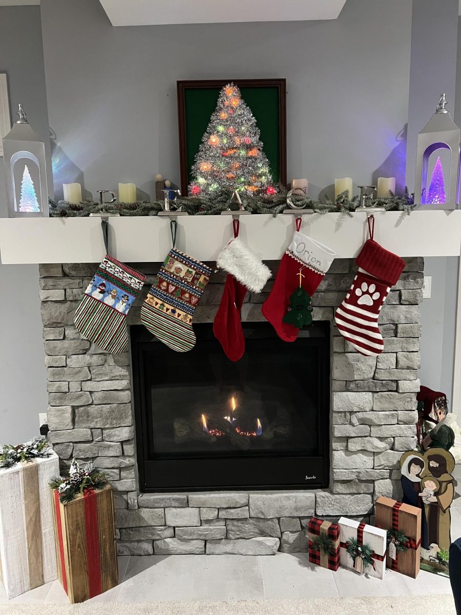 Cathryn Monroe also arranges her fireplace with her family's stockings and the garland made by her grandmother for the holiday season.