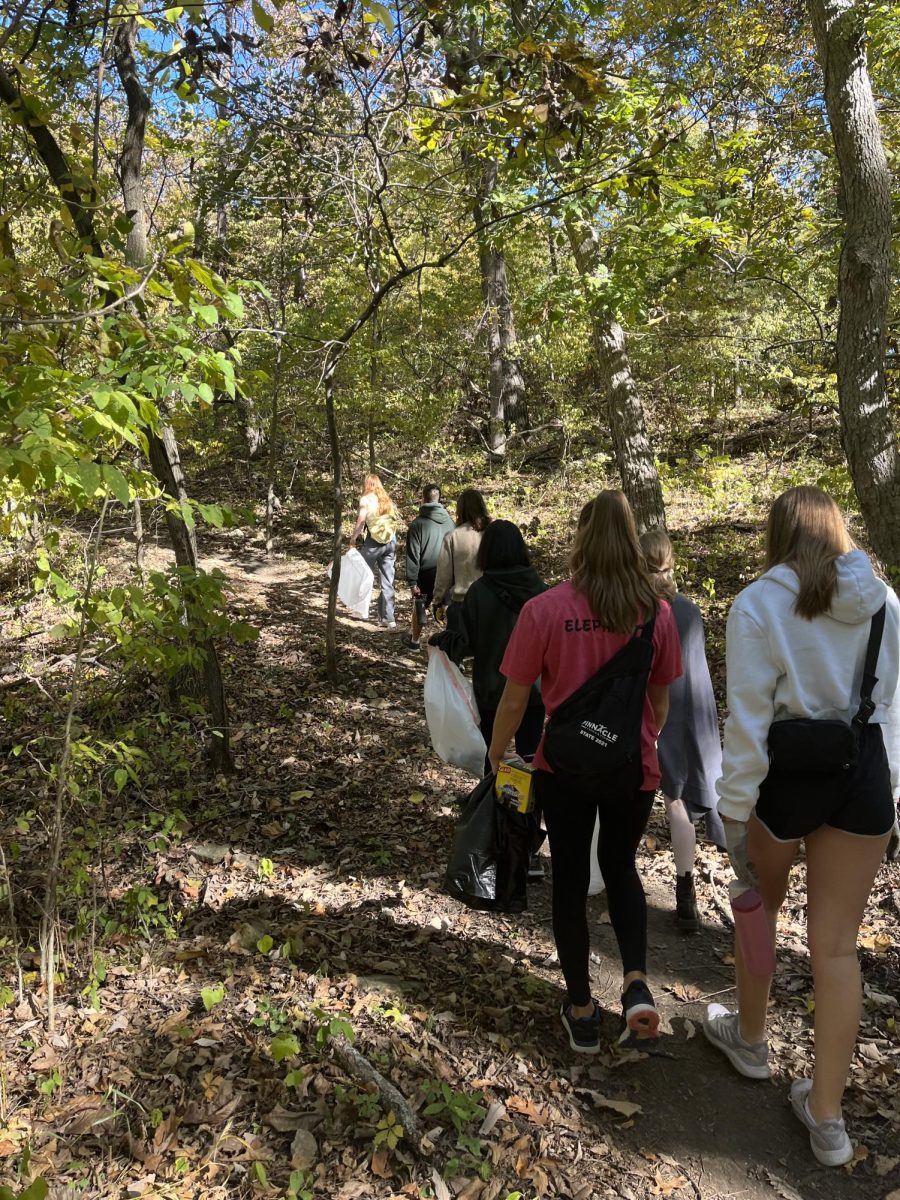 Environmental club on a hike picking up trash at Kill Creek Park.